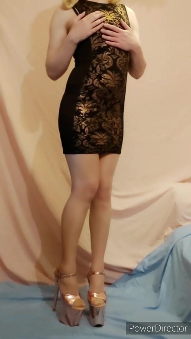 Sissy in a tight and slutty black and gold dress and heels